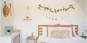 Hat and decorations hung on the wall with Command metallic and clear hooks
