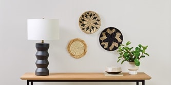 Decorative objects mounted on the wall using Command picture hangers.
