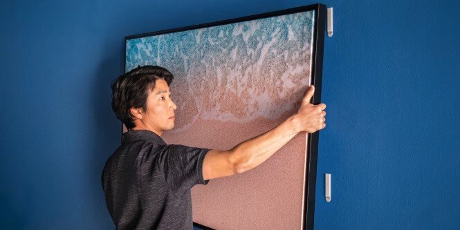 Hanging heavy paintings with Command™ picture hanging strips without nails
