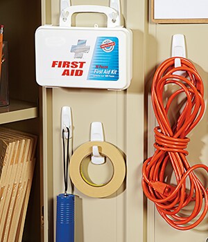 Select convenient locations for the Command™ Hooks such as inside a storage cabinet and on the wall next to a printer
