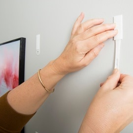 To remove the strips, slowly stretch down against the wall.