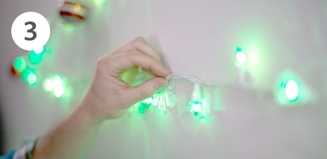 Command™ Utensil Hooks to hang Christmas ornaments on wall
