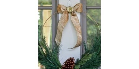Elegant Christmas wreath with gold ribbon displayed using Command Clear Hook
