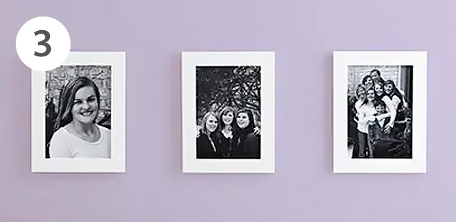 Photo frames attached with Command™ Picture Hanging Strips.
