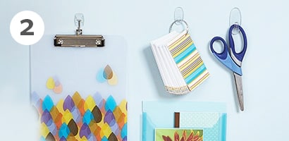 Command hooks as wall hanging solutions for home office room
