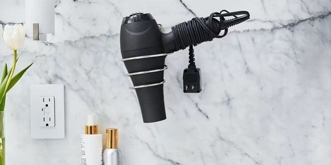 mount the hair dryer on the wall using the Command metal hair dryer holder
