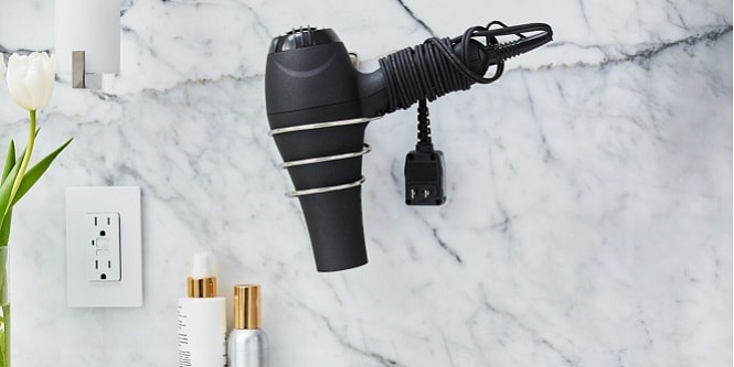 mount the hair dryer on the wall using the Command metal hair dryer holder
