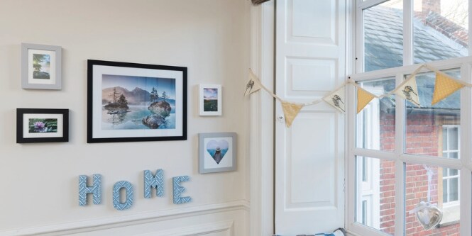 HOME cutouts displayed with picture hangers from command

