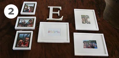 Letter E monogram surrounded by photo frames
