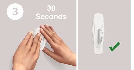 Step 3 of installing wall hooks: remove black liner and press hook to wall for 30 seconds
