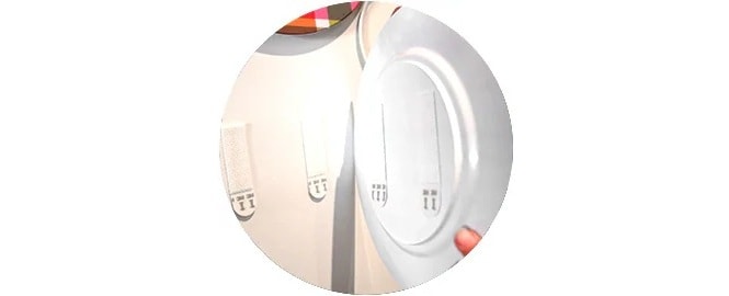 Apply Command picture hanging strips to a decorative plate.
