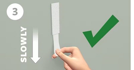 Step 3 of removing command strips
