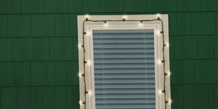 Hanging Christmas hooks for lights around the window
