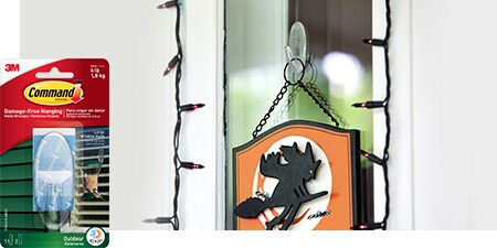 Welcome your party guests with Halloween door signs hung using Command™ Outdoor Clear Window Hooks.
