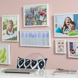 Family portraits displayed behind an office desk