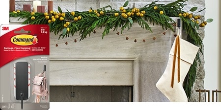 A beautiful wall decorated with narrow picture frames and plants using Command narrow picture hanging strips and decorative hooks.
