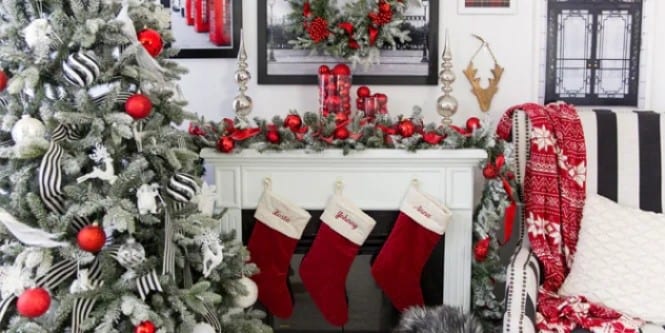 Christmas stockings and Christmas balls decorating the fireplace
