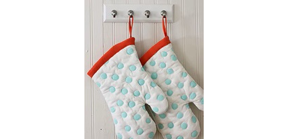 Step 3 using kitchen hooks to hang mitts
