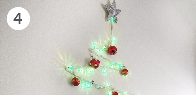 DIY string light christmas tree on wall
