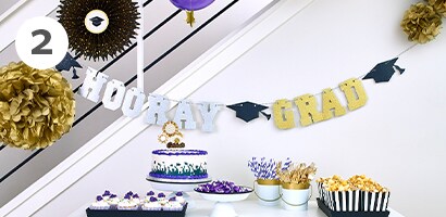 Hanging garlands as a graduation party backdrop
