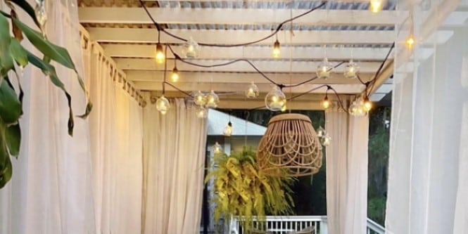 Christmas lights dot the ceiling of this front verandah.
