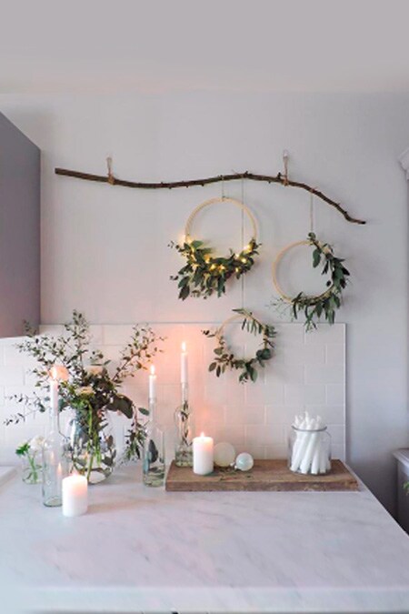 Green branches and holiday sprigs displayed in the kitchen