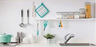 picture frames and artworks displayed using command wall hanging hooks
