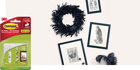 Hang framed Halloween prints near the party table using no-drill Command™ Picture Hanging Strips to add style to your indoor décor.
